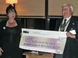 President of the Rotary Club of Abingdon Vesper, Richard Benton, presents a cheque for �2000 to Sharon Hylton of OXPIP